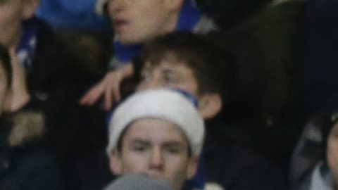 Chelsea fans, wearing Christmas themed hats, watch as Southampton's Fraser Forster takes a goal kick during the English Premier League soccer match between Chelsea and Southampton at Stamford Bridge in London, Saturday Dec. 16, 2017. (AP Photo/Tim Ireland)