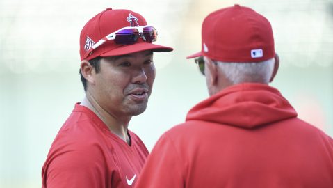 Los Angeles Angels' Kurt Suzuki left, talks with Los Angeles Angels manager Joe Maddon during batting practice before a baseball game against the Baltimore Orioles, Tuesday, Aug. 24, 2021, in Baltimore. (AP Photo/Terrance Williams)