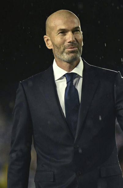France soccer star Zinedine Zidane arrives on stage at the Trocadero during the opening ceremony for the 2024 Summer Olympics in Paris, France, Friday, July 26, 2024. (Loic Venance/Pool Photo via AP)