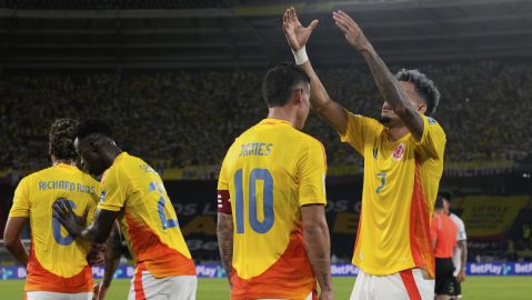Colombia's James Rodriguez (10) is congratulated by teammate Luis Diaz after scoring his side's opening goal against Bolivia during a World Cup 2026 qualifying soccer match at Metropolitano stadium in Barranquilla, Colombia, Thursday, Sept. 4, 2025. (AP Photo/Fernando Vergara)