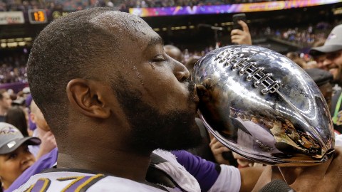 FILE - Baltimore Ravens defensive end Arthur Jones (97) kisses the Vince Lombardi Trophy after defeating the San Francisco 49ers in the NFL Super Bowl XLVII football game, Sunday, Feb. 3, 2013, in New Orleans. (AP Photo/Dave Martin, File)