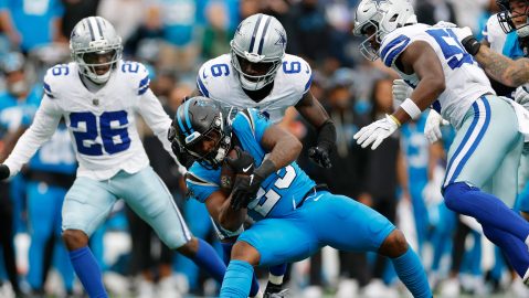 Carolina Panthers' Trevor Etienne (23) is stopped by Dallas Cowboys safety Donovan Wilson (6) in the second half of an NFL football game, Sunday, Oct. 12, 2025, in Charlotte, N.C. (AP Photo/Rusty Jones)