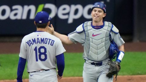 Los Angeles Dodgers catcher Will Smith and Yoshinobu Yamamoto celebrate after Game 2 of baseball's National League Championship Series against the Milwaukee Brewers Tuesday, Oct. 14, 2025, in Milwaukee. (AP Photo/Morry Gash)
