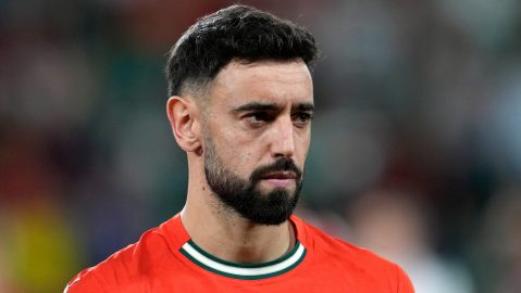 Portugal's Bruno Fernandes stands on the pitch before a World Cup 2026 group F qualifying soccer match between Portugal and Hungary in Lisbon, Tuesday, Oct. 14, 2025. (AP Photo/Armando Franca)