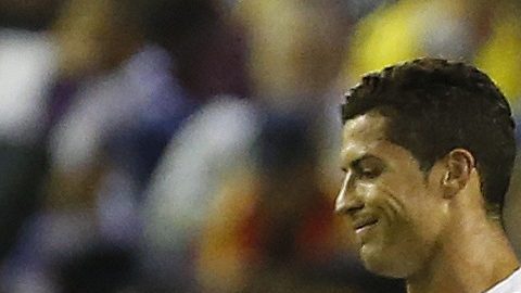 Real Madrid's Cristiano Ronaldo, left, walks past Liverpool's Steven Gerrard after Karim Benzema scored his side's third goal during the Champions League group B soccer match between Liverpool and Real Madrid at Anfield Stadium, Liverpool, England, Wednesday Oct. 22, 2014. (AP Photo/Jon Super)