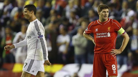 Real Madrid's Cristiano Ronaldo, left, walks past Liverpool's Steven Gerrard after Karim Benzema scored his side's third goal during the Champions League group B soccer match between Liverpool and Real Madrid at Anfield Stadium, Liverpool, England, Wednesday Oct. 22, 2014. (AP Photo/Jon Super)