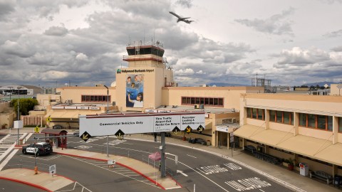 A plane takes off from normally bustling Hollywood Burbank Airport, Friday, March 20, 2020, in Burbank, Calif. California Gov. Gavin Newsom is ordering the state's 40 million residents to stay at home indefinitely. His order restricts non-essential movements to control the spread of the coronavirus that threatens to overwhelm the state's medical system. He called up 500 National Guard troops Thursday to help with distributing food. (AP Photo/Mark J. Terrill)