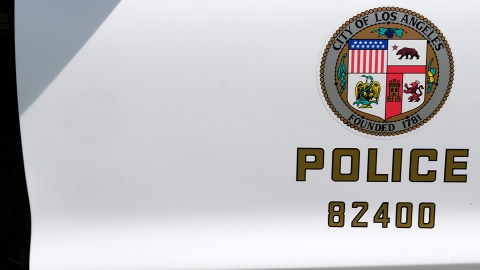 A Los Angeles Police Department sticker is seen on a door panel of a prototype of the Ford Fusion police hybrid car in Los Angeles, Monday, April 10, 2017. Ford Motor Co., which sells more police cars in the U.S. than any other automaker, says it will offer a police pursuit version of the hybrid Fusion midsize sedan, in response to requests from cities nationwide. (AP Photo/Richard Vogel)
