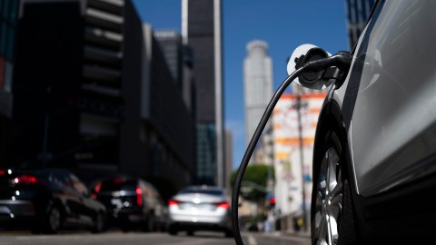 An electric vehicle is plugged into a charger in Los Angeles, Thursday, Aug. 25, 2022. California plans to require all new cars, trucks and SUVs to run on electricity or hydrogen by 2035 under a policy approved Thursday by regulators that seeks a dramatic cut in carbon emissions and an eventual end to gasoline-powered vehicles. (AP Photo/Jae C. Hong)