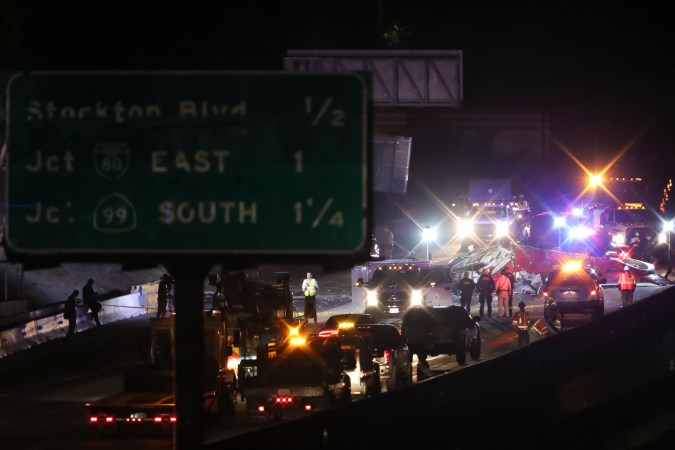 A medical helicopter is shown after it crashed on Highway 50 Monday, Oct. 6, 2025, in Sacramento, Calif. (AP Photo/Scott Marshall)