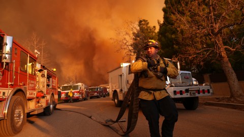 Firefighters make a stand in front of the Palisades Fire in Mandeville Canyon on Saturday, Jan. 11, 2025, in Los Angeles. (AP Photo/Jae C. Hong)