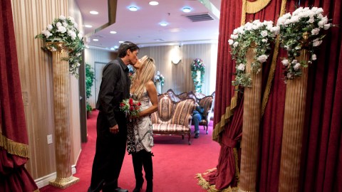 Christopher Pruett, left, and Cindy Zuniga of Honolulu, Hawaii, kiss after being pronounced man and wife at the Little White Wedding Chapel, Monday, Feb. 14, 2011 in Las Vegas. Fewer than 92,000 couples married in or around Sin City last year. The last time the city of drive-through wedding chapels married fewer people, it was 1993. The wedding industry hopes Valentine's Day provides some much needed sizzle, but they aren't betting on it. (AP Photo/Julie Jacobson)