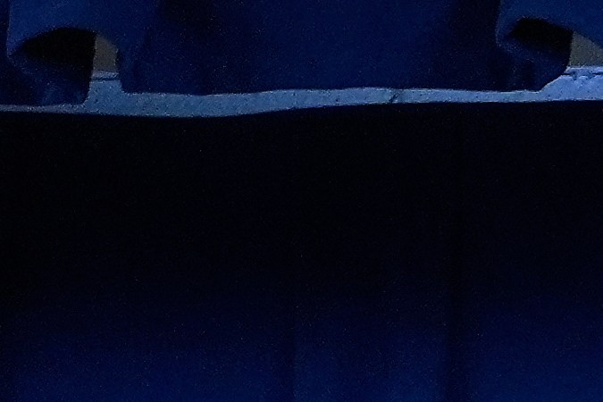 Acting U.S. Attorney Bill Essayli, middle, gestures while speaking during a news conference announcing an arrest made in the Palisades Fire, Wednesday, Oct. 8, 2025, in Los Angeles. (AP Photo/Damian Dovarganes)