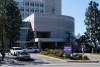 Vehicles leave Harbor-UCLA Medical Center Wednesday, Feb. 24, 2021, in Torrance, Calif. Golfer Tiger Woods was hospitalized and underwent surgery at the hospital following a car accident on Tuesday. (AP Photo/Ashley Landis)