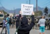 Protesters standoff against federal immigration agents during a raid in the agriculture area of Camarillo, Calif., Thursday, July 10, 2025. (AP Photo/Michael Owen Baker)