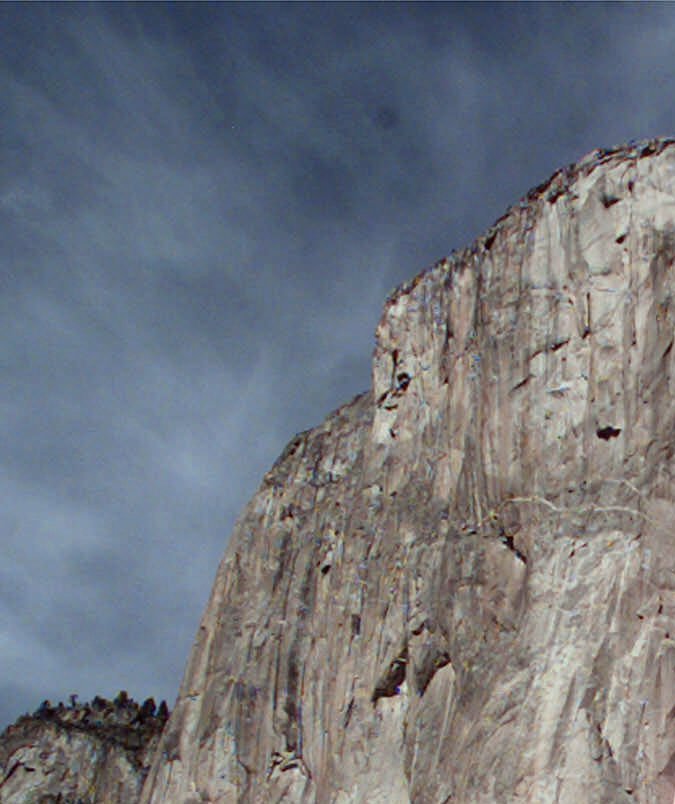 A protestor holds a sign in front of El Capitan in Yosemite, Calif., National Park before skydiver Jan Davis, 60, died after attempting to parachute Friday, Oct. 22, 1999. The skydivers jumped in a protest against the policy of skydiving in Yosemite. The organization "It's Our Park Too!" and the National Park Service worked out an agreement for several skydivers to jump Friday. (AP Photo/Paul Sakuma)