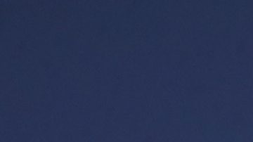 A man waves a flag commemorating soccer legend Diego Maradona outside the San Paolo stadium, in Naples, southern Italy, Thursday, Nov. 26, 2020. Maradona died Wednesday, Nov. 25 in Buenos Aires. (AP Photo/Alessandra Tarantino)