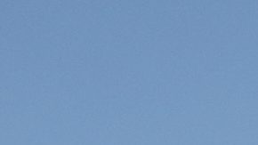 A helicopter flies a Mexican flag over the Hermanos Rodriguez racetrack prior to the start of the Formula One Mexico Grand Prix in Mexico City, Sunday, Oct. 26, 2025. (AP Photo/Eduardo Verdugo)