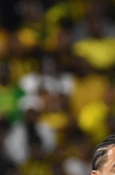 Curacao's Roshon Van Eijma, in the air, fights for the ball with Jamaica's Gregory Leigh, right, and Jonathan Russell during a World Cup 2026 qualifying soccer match in Kingston, Jamaica, Tuesday, Nov. 18, 2025. (AP Photo/Collin Reid)