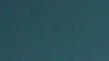 In this Wednesday, March 25, 2015, photo, Internal Revenue Service Special Agent In Charge Jonathan Larsen, holds a Smith & Wesson .38 Special during an interview in Mountainside, N.J. The gun belonged to IRS investigator Michael Malone, the man who went undercover to infiltrate Al Capones gang in the 1930s and eventually brought down the feared mobster. (AP Photo/Julio Cortez)