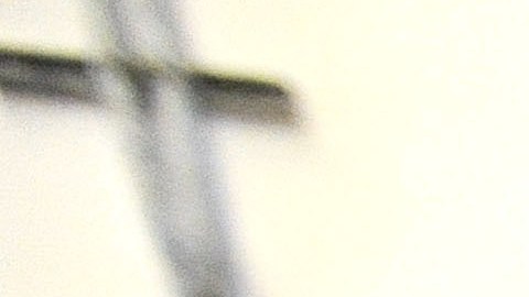 FILE - In this Nov. 14, 2013 file photo, a corrections officer stands near a gate at Baltimore City Detention Center in Baltimore. Inside the Baltimore City Detention Center, gang members used smuggled cellphones, dealt drugs and had sex with corrupt guards  several of whom they impregnated  who helped them as they ran operations of the Black Guerilla Family, according to court papers in a case alleging widespread corruption at the state-run facility. (AP Photo/Steve Ruark, FIle)