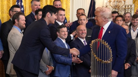 President Donald Trump, right, greets Los Angeles Dodgers' Shohei Ohtani during a ceremony to honor the Major League Baseball 2024 World Series Champion team in the East Room of the White House, Monday, April 7, 2025, in Washington. (AP Photo/Evan Vucci)