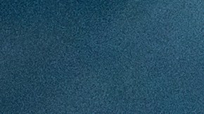 A surfer rides a wave as clouds gather above Bolsa Chica State Beach in Orange County, Calif., on Saturday, Nov. 15, 2025. (AP Photo/Noah Berger)