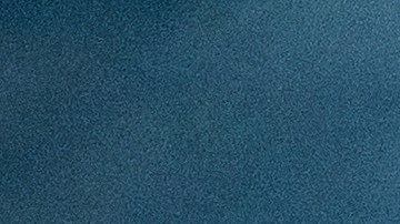 A surfer rides a wave as clouds gather above Bolsa Chica State Beach in Orange County, Calif., on Saturday, Nov. 15, 2025. (AP Photo/Noah Berger)