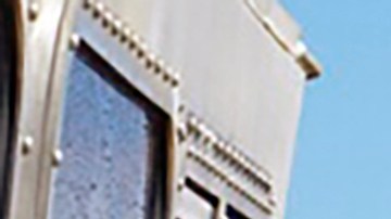 CORRECTS THE NAME OF THE PHOTOGRAPHER - In this photo released by the U.S. Coast Guard, Coast Guard Cutter William Hart moves toward the Na Pali Coast on the Hawaiian island of Kauai on Friday, Dec. 27, 2019, the day after a tour helicopter disappeared with seven people aboard. Authorities say wreckage of the helicopter has been found in a mountainous area on the island. (MK3 Forest Herring/U.S. Coast Guard via AP)