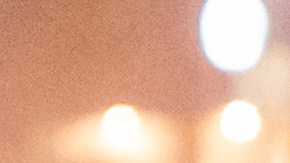 A person uses cardboard to stay dry as rain falls in Los Angeles on Friday, Nov. 14, 2025. (AP Photo/Noah Berger)