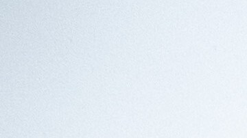 James Jones places a sandbag to prevent water from running off a property scorched in the Eaton Fire in Altadena, Calif., as the region remains under flash flood warnings on Saturday, Nov. 15, 2025. (AP Photo/Noah Berger)