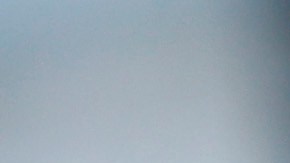 A handcuffed suspect waits inside a police bus during an operation against alleged drug traffickers at the Complexo do Alemao slum in Rio de Janeiro, Brazil, Saturday, Nov. 27, 2010. Soldiers and police crouching behind armored vehicles trained their rifles on dozens of entrances to a sprawling slum Saturday, preparing to invade and try to push drug gangs out an area long considered the most dangerous in Rio de Janeiro, a city set to host the 2016 Olympics. (AP Photo/Felipe Dana)