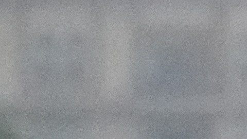 A commuter walks under heavy rain in downtown Los Angeles, Monday, Nov. 17, 2025. (AP Photo/Damian Dovarganes)