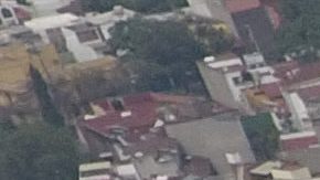 Pollution blankets the sky over the iconic Estadio Azteca and the rest of Mexico City, Thursday, May 16, 2019. A semifinal match between America and Leon that had already been postponed due to air quality will be played out of the city in Queretaro on Thursday. (AP Photo/Rebecca Blackwell)