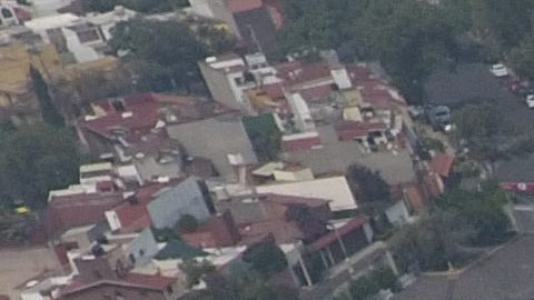 Pollution blankets the sky over the iconic Estadio Azteca and the rest of Mexico City, Thursday, May 16, 2019. A semifinal match between America and Leon that had already been postponed due to air quality will be played out of the city in Queretaro on Thursday. (AP Photo/Rebecca Blackwell)