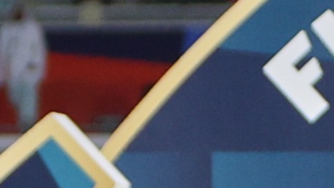 Flamengo's Bruno Henrique lifts the trophy after winning the FIFA Intercontinental Cup soccer match against Pyramids in Doha, Qatar, Saturday, Dec. 13, 2025. (AP Photo/Hussein Sayed)