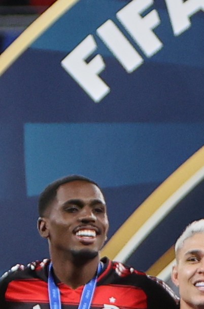 Flamengo's Bruno Henrique lifts the trophy after winning the FIFA Intercontinental Cup soccer match against Pyramids in Doha, Qatar, Saturday, Dec. 13, 2025. (AP Photo/Hussein Sayed)
