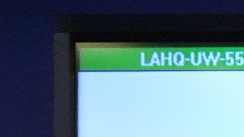 Photos of suspects of a terror plot are shown on a screen during a press conference Monday, Dec. 15, 2025, in Los Angeles. (AP Photo/Damian Dovarganes)