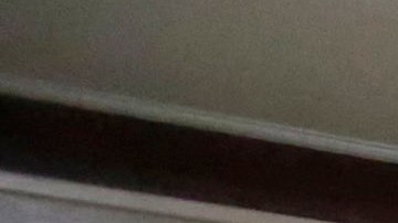 In this March 3, 2015 photo, Immigration and Customs Enforcement officers escort an arrestee in an apartment building, in the Bronx borough of New York, during a series of early-morning raids. Immigrant and Customs Enforcement say an increasing number of cities and counties across the United States are limiting cooperation with the agency and putting its officers in dangerous situations as they track down foreign-born criminals. Instead, more of its force is out on the streets, eating up resources and conducting investigations because cities like New York and states like California have passed legislation that limits many of the detention requests issued by immigration authorities. (AP Photo/Richard Drew)