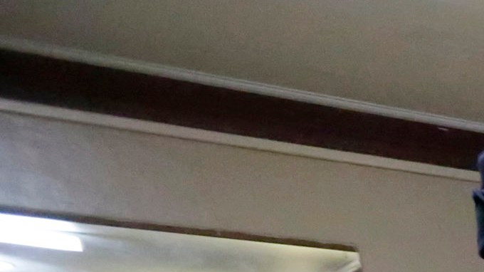 In this March 3, 2015 photo, Immigration and Customs Enforcement officers escort an arrestee in an apartment building, in the Bronx borough of New York, during a series of early-morning raids. Immigrant and Customs Enforcement say an increasing number of cities and counties across the United States are limiting cooperation with the agency and putting its officers in dangerous situations as they track down foreign-born criminals. Instead, more of its force is out on the streets, eating up resources and conducting investigations because cities like New York and states like California have passed legislation that limits many of the detention requests issued by immigration authorities. (AP Photo/Richard Drew)