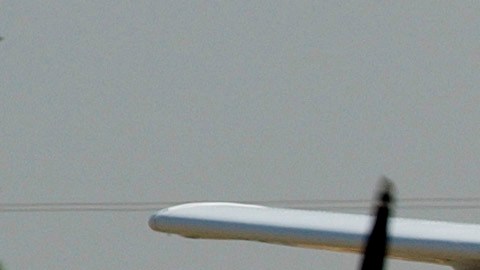 A Cessna 172 aircraft piloted by 11-year-old Jimmy Haywood and 14-year-old Kenny Roy comes in for a landing at Compton-Woodley Airport in Compton, Calif., after a flight that originated in Vancouver, Canada, Saturday, Sept. 25, 2004. Roy became the youngest African-American to ever fly solo Friday, receiving his license and soloing in Canada where the law allows 14-year-olds to be licensed; the minimum age in the United States is 16. Haywood became the youngest black male to pilot a plane on a round-trip international flight. A flight instructor accompanied the pair on the trip. (AP Photo/Reed Saxon)