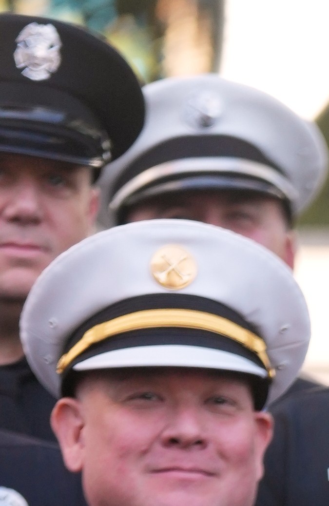 Eniola Taiwo, 14, of Orange, Conn., who wrote a school essay calling for Los Angeles firefighters to be recognized with a star for heroism during last January's Palisades and Sunset Fires, stands alongside Los Angeles Fire Department Chief Jamie Moore during a ceremony honoring the LAFD with an Award of Excellence star, Friday, Dec. 12, 2025, on Hollywood Blvd. in Los Angeles. (AP Photo/Chris Pizzello)