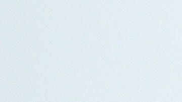 A tourist from China battles the rain on the Santa Monica pier Wednesday, Dec. 24, 2025, in Santa Monica, Calif. (AP Photo/Wally Skalij)