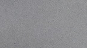 A visitor covers themselves with an umbrella at an overlook at the Griffith Park Observatory during a storm on Tuesday, Oct. 14, 2025, in Los Angeles. (AP Photo/Damian Dovarganes)