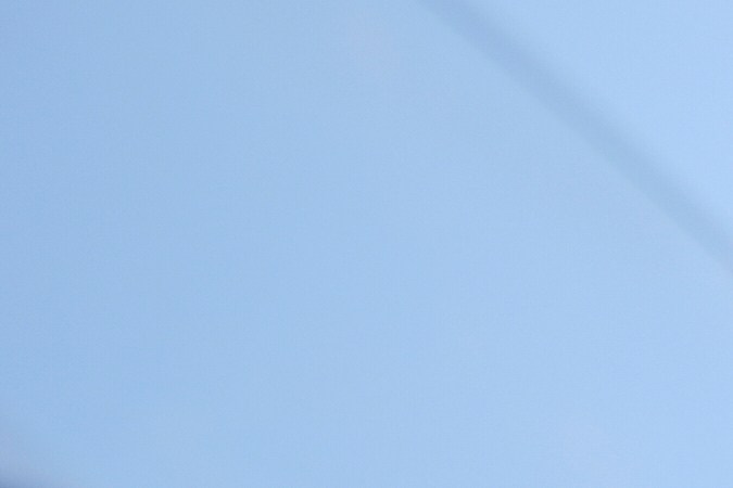 A protester confronts a line of U.S. National Guard in the metropolitan detention center of downtown Los Angeles, Sunday, June 8, 2025, following last night's immigration raid protest. (AP Photo/Eric Thayer)