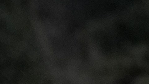 Aundre Smith, left, watches as Genesis Smith places flowers near the scene of a mass shooting on Saturday at a banquet hall in Stockton, Calif., Monday, Dec. 1, 2025. (AP Photo/Jeff Chiu)