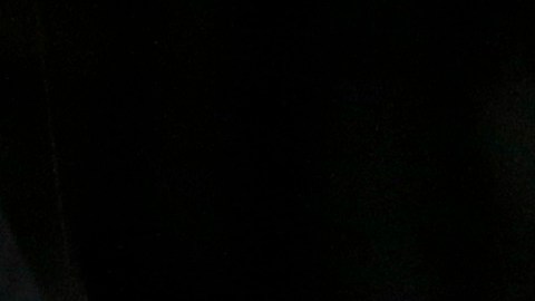 A California Highway Patrol officer sits in his car Thursday, Dec. 3, 2015, near the scene where a police shootout with suspects took place on Wednesday, in San Bernardino, Calif. A heavily armed man and woman opened fire Wednesday on a holiday banquet for his co-workers, killing multiple people and seriously wounding others in a precision assault, authorities said. Hours later, they died in the shootout with police. (AP Photo/Jae C. Hong)