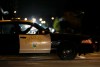 A California Highway Patrol officer sits in his car Thursday, Dec. 3, 2015, near the scene where a police shootout with suspects took place on Wednesday, in San Bernardino, Calif. A heavily armed man and woman opened fire Wednesday on a holiday banquet for his co-workers, killing multiple people and seriously wounding others in a precision assault, authorities said. Hours later, they died in the shootout with police. (AP Photo/Jae C. Hong)