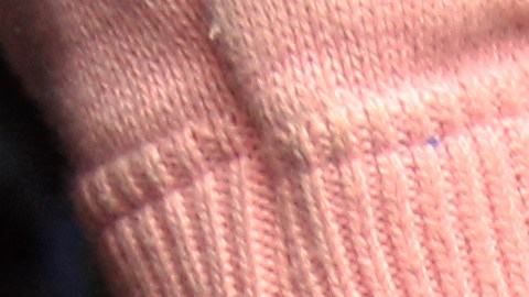 An unidentified female Colombian suspect in handcuffs is presented to the press after her Monday arrest in connection with seized cocaine at a police base in Lima, Peru, Wednesday Aug. 17, 2011. According to police, about one ton of cocaine was seized during two operations, on Aug. 11 and Aug. 15 in Lima and in the northern province of Paita, and four Colombians were arrested. (AP Photo/Martin Mejia)