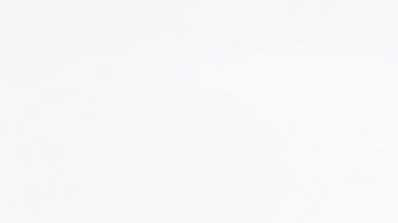 FILE - In this June 22, 2016 file photo, Border Patrol agent Eduardo Olmos walks near the secondary fence separating Tijuana, Mexico, background, and San Diego in San Diego. U.S. President Donald Trump will direct the Homeland Security Department to start building a wall at the Mexican border. (AP Photo/Gregory Bull, file)